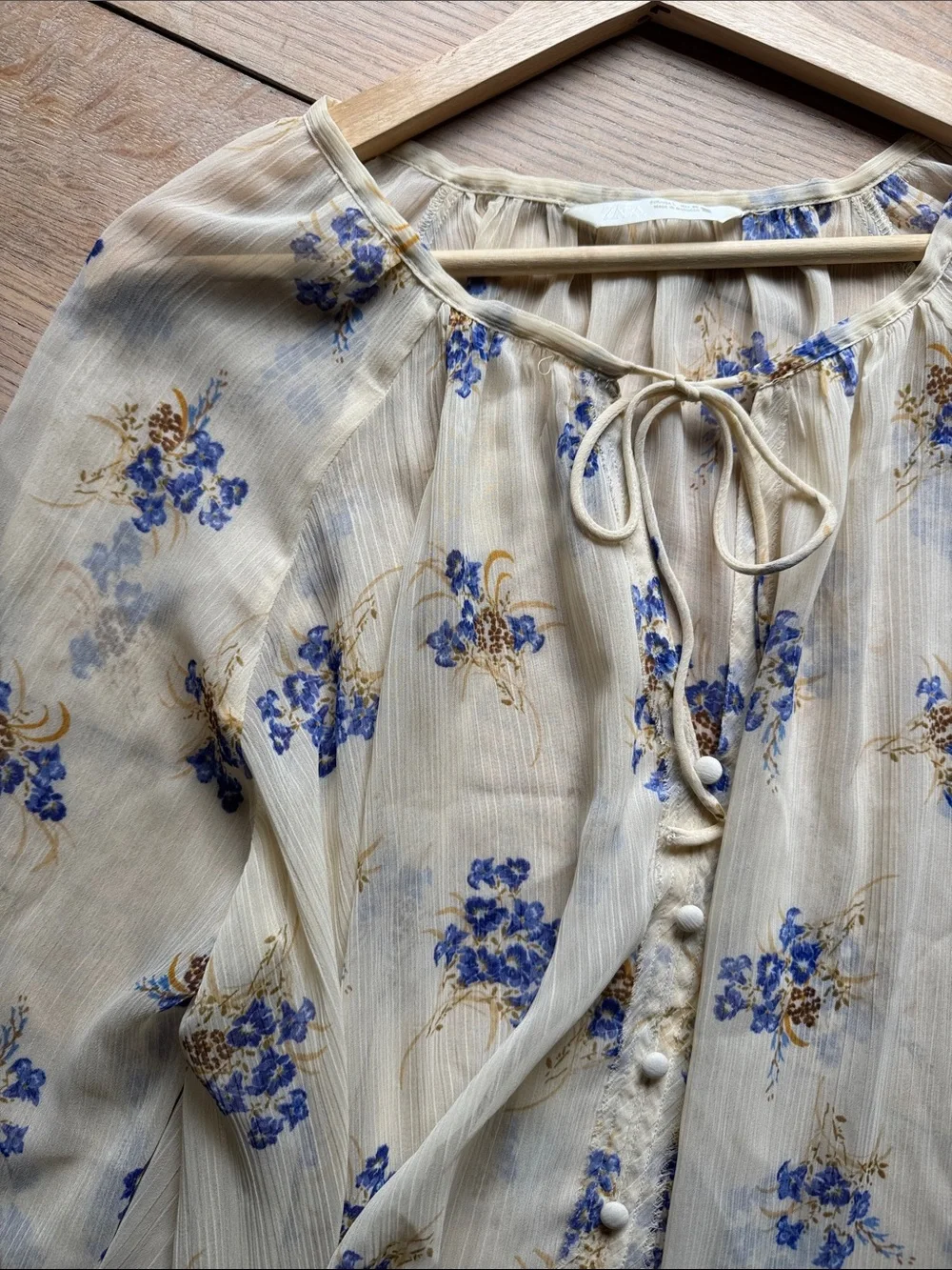 Zara Cream Floral Tie-Neck Blouse with Blue Accents